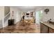 Open-concept dining area with wood floors and access to the living room at 16671 E Prairie Goat Ave, Parker, CO 80134