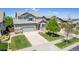 Beautiful two-story home with landscaped yard, large driveway, and an attached garage at 16671 E Prairie Goat Ave, Parker, CO 80134
