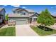 Charming two-story home with a well-manicured lawn and inviting curb appeal at 16671 E Prairie Goat Ave, Parker, CO 80134