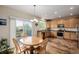 Kitchen with wood cabinets, stainless steel appliances, and access to the deck at 16671 E Prairie Goat Ave, Parker, CO 80134