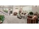 Bright living room featuring plush carpet, comfortable seating, and stylish decor throughout at 16671 E Prairie Goat Ave, Parker, CO 80134