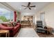 Open-concept living room flowing into the kitchen with hardwood floors, and comfortable furnishings at 16671 E Prairie Goat Ave, Parker, CO 80134