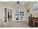 Inviting office with a built-in bookcase, a ceiling fan, and plenty of natural light from the window at 16671 E Prairie Goat Ave, Parker, CO 80134