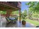 Covered patio with comfortable seating and spacious backyard at 16671 E Prairie Goat Ave, Parker, CO 80134