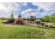 Well-maintained community playground featuring swings, playset, park shelter and artificial ground cover at 16671 E Prairie Goat Ave, Parker, CO 80134