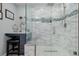 Walk in shower with custom tile work, rain shower head, and built-in bench at 16671 E Prairie Goat Ave, Parker, CO 80134