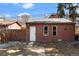 Detached garage with white door in backyard at 16 N Pennsylvania St, Denver, CO 80203