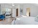 Bedroom with a large mirror closet, a view into the ensuite and ample natural light at 16 N Pennsylvania St, Denver, CO 80203