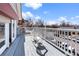 Outdoor deck with white railing and furniture overlooking a neighborhood street at 16 N Pennsylvania St, Denver, CO 80203