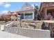 Inviting two-story home with a cozy covered porch and elevated balcony, showcasing a welcoming exterior at 16 N Pennsylvania St, Denver, CO 80203