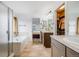 Bright bathroom with shower and tub, featuring dual sinks, a walk-in closet, and plenty of natural light at 22765 E Ottawa Pl, Aurora, CO 80016