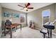 Bedroom features a ceiling fan, neutral walls, and multiple windows for natural light at 22765 E Ottawa Pl, Aurora, CO 80016