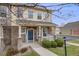 Charming two-story home with a welcoming front porch, stone accents, and well-maintained landscaping at 22765 E Ottawa Pl, Aurora, CO 80016