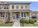 Charming two-story home with a welcoming front porch, stone accents, and well-maintained landscaping at 22765 E Ottawa Pl, Aurora, CO 80016