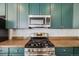 Updated kitchen with granite countertops, stainless steel oven and microwave at 22765 E Ottawa Pl, Aurora, CO 80016