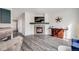 Cozy living room featuring a fireplace, modern decor, and comfortable seating at 22765 E Ottawa Pl, Aurora, CO 80016