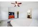 Comfortable main bedroom featuring a ceiling fan and a walk-in bathroom, creating a serene and convenient space at 22765 E Ottawa Pl, Aurora, CO 80016