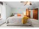 Cozy bedroom features a ceiling fan, natural light, and neutral color palette at 6402 W 81St Ave, Arvada, CO 80003