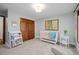 Neutral Bedroom with crib, bookcase, and artwork at 6402 W 81St Ave, Arvada, CO 80003