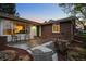 Inviting brick home featuring a cozy front porch, perfect for relaxing outdoors at 6402 W 81St Ave, Arvada, CO 80003