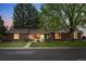 Charming brick home featuring a well-manicured lawn and inviting curb appeal at 6402 W 81St Ave, Arvada, CO 80003