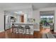 A brightly lit kitchen boasts stainless appliances and a stylish breakfast bar at 6402 W 81St Ave, Arvada, CO 80003