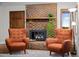 Living room with a beautiful fireplace and comfortable chairs at 6402 W 81St Ave, Arvada, CO 80003