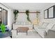Inviting living room with comfortable seating, natural light, and stylish decor at 6402 W 81St Ave, Arvada, CO 80003
