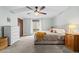 A neutral toned main bedroom with warm, natural light and ample space at 6402 W 81St Ave, Arvada, CO 80003