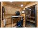 Wooden walled office with desk and adjustable standing desk at 6402 W 81St Ave, Arvada, CO 80003