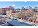 Scenic city view with a mix of brick buildings, skyscrapers, and street-level activity at 1732 Wazee St # 201, Denver, CO 80202