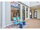 Inviting lobby area with stylish Adirondack chairs, a colorful rug, and views into the interior space at 1732 Wazee St # 201, Denver, CO 80202