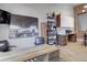 Bright office area featuring modern decor, hardwood floors, and a view of the kitchen at 1732 Wazee St # 201, Denver, CO 80202