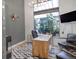 Bright office area featuring modern decor, hardwood floors, and a large window with green outdoor view at 1732 Wazee St # 201, Denver, CO 80202
