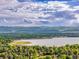 A scenic aerial view of a lake and residential area at 4720 W Stanford Ave, Denver, CO 80236