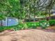 A brick patio surrounded by manicured landscaping including a garden in the backyard at 4720 W Stanford Ave, Denver, CO 80236