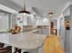 Bright kitchen showcasing granite countertops, stainless steel appliances, and a modern pendant light at 4720 W Stanford Ave, Denver, CO 80236