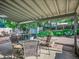 Outdoor patio with a table, chairs, grill and landscaped backyard at 4720 W Stanford Ave, Denver, CO 80236