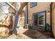 Backyard featuring a fenced in dirt yard with a sliding glass door and mature tree at 2927 W 81St Ave # B, Westminster, CO 80031