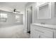 Bright bathroom featuring a white vanity with granite countertop, modern fixtures, and ample natural light at 2927 W 81St Ave # B, Westminster, CO 80031