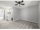 Spacious bedroom with neutral carpet, ceiling fan, and ensuite bathroom with vanity at 2927 W 81St Ave # B, Westminster, CO 80031