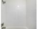 Detail of a white-tiled shower-tub combination featuring chrome fixtures at 2927 W 81St Ave # B, Westminster, CO 80031
