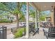 Inviting front porch with comfortable seating, decorative pillows, and a view of the neighborhood at 2436 W Argyle Pl, Denver, CO 80211