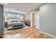 A light and airy main bedroom with hardwood floors, ceiling fan and recessed lighting at 2436 W Argyle Pl, Denver, CO 80211
