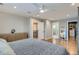 A spacious main bedroom suite includes hardwood flooring and an adjoining walk-in closet and bath at 2436 W Argyle Pl, Denver, CO 80211