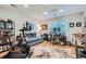 This light filled home office features hardwood floors and versatile space for working and exercising at 2436 W Argyle Pl, Denver, CO 80211