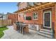 Outdoor kitchen area with a built-in grill, sink, and seating perfect for entertaining at 2436 W Argyle Pl, Denver, CO 80211