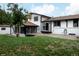 Spacious backyard features a lush lawn, patio area, and white exterior, perfect for relaxation at 8249 Zephyr St, Arvada, CO 80005