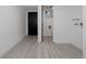 Finished basement space with a door to an adjacent bathroom at 8249 Zephyr St, Arvada, CO 80005