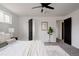 Comfortable bedroom with a ceiling fan, neutral decor, and ample natural light creating a calming retreat at 8249 Zephyr St, Arvada, CO 80005